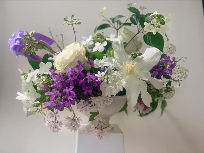Purple and white blooms with lilies and greenery